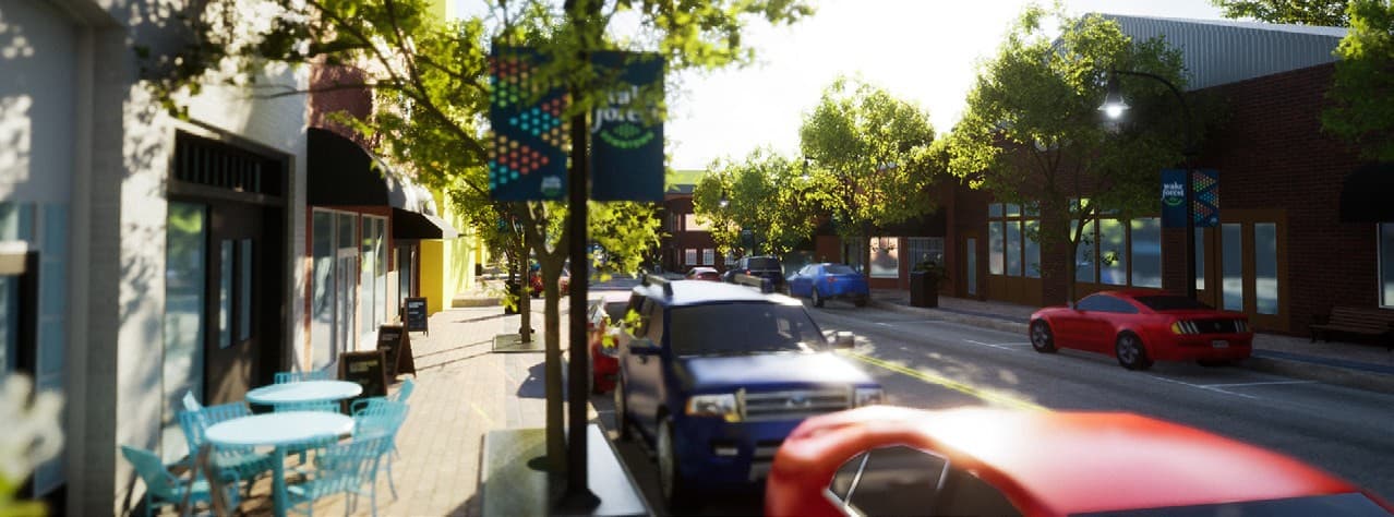 Street-level render from the digital twin: a downtown Wake Forest sidewalk with café seating, street banners, trees and parked cars